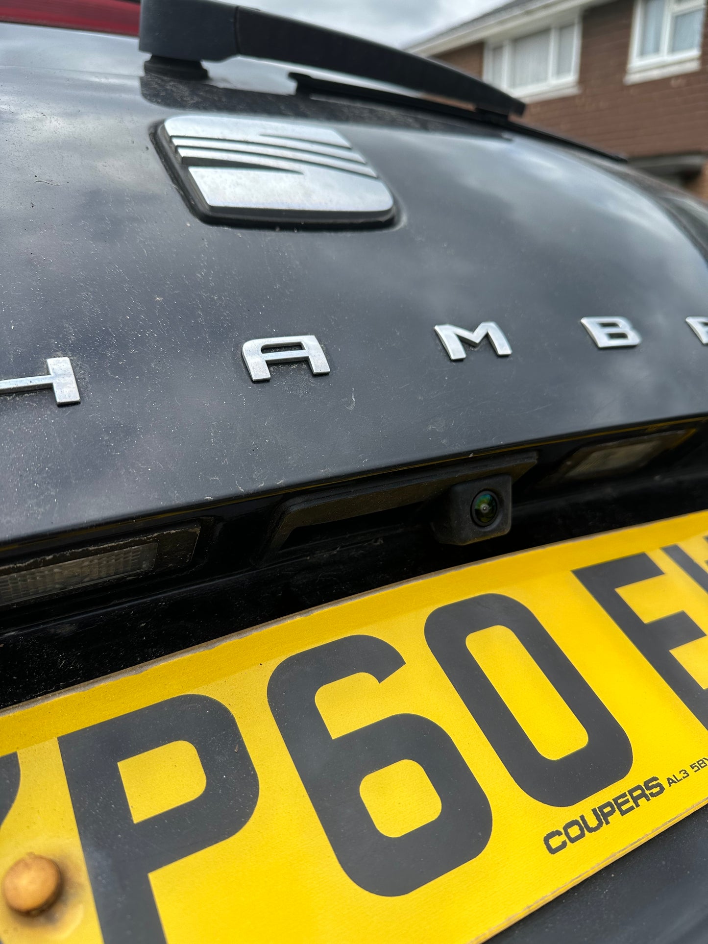 Original reverse camera support and custom aftermarket reverse camera